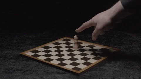 Wide shot on a hand taking down the queen on a chessboard Slow motion at 200Fps 스톡 동영상 103546039