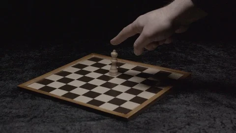 Wide shot on a hand taking down the queen on a chessboard Slow motion at 200Fps 스톡 동영상 103547126