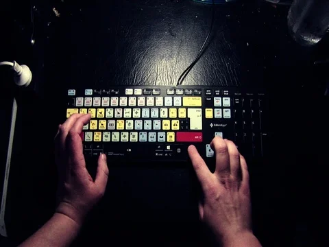 Wide shot of hands typing on a keyboard. Stock Footage 80014546