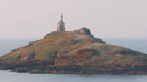 Wide shot of the Ilot Saint Michel, a small rocky islet off the coast of Erquy Stock Footage 346666795