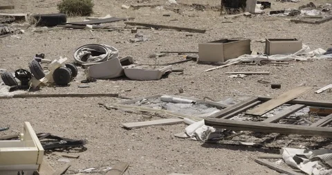 Wide Shot of Junk In Desert with 2018 Car in Background Stock Footage 89942091