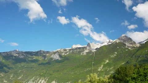 Wide shot of Kanin mountain range above Bovec during the day in Slovenia, Europe Stock Footage 341925863