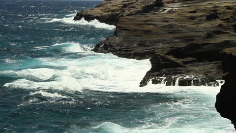 Wide-shot of large waves pounding Oahu's rugged east shore Stock Footage 242465529
