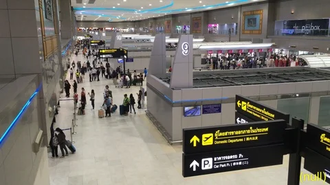 Wide shot, looking down on travellers arriving and departing time lapse. Video stock 99070257