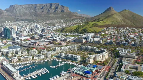 Wide shot looking out over the Waterfront with the city and mountains behind it Stock Footage 169887674