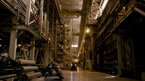 Wide Shot Low Angles of Forklift in Modern Factory - Flag in Foreground Stock Footage 89944504
