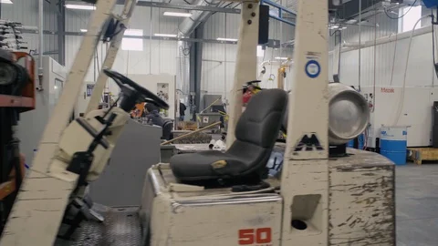 Wide shot of machine shop Stock Footage 103336552