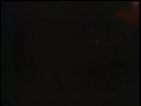 Wide shot of massive explosion near barn Stock Footage 260255002