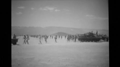 Wide shot of military soldiers and military tank Stock Footage