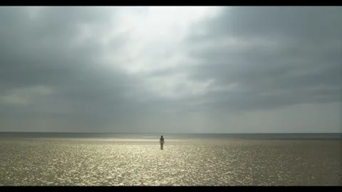 Wide shot of model against the sky and sea Video stock 297207791