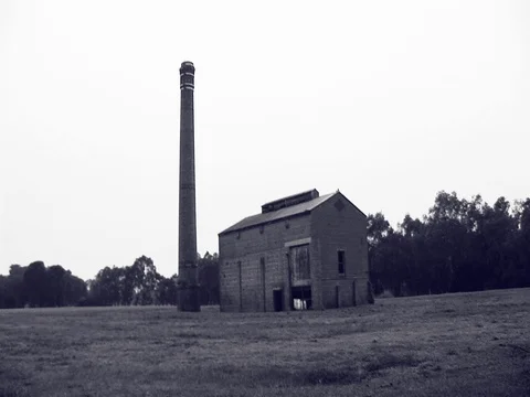 Wide shot of an old abandoned building, black and white. Stock Footage 79905789