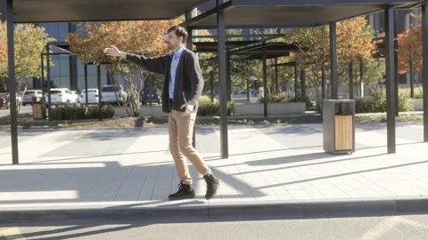 Wide shot of one man gesturing in frustration, cinematic style, autumn park. Stock Footage 331820134