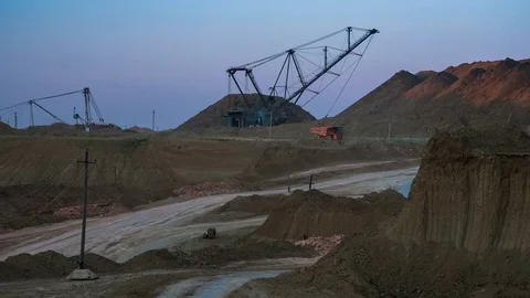 Wide shot of operating mine with dragline excavators loading ore in the Stock Footage 75456000