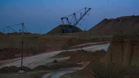 Wide shot of operating mine with dragline excavators loading ore in the Stock Footage 75456727