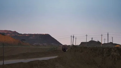 Wide shot of operating mine with dragline excavators loading ore in the Stock Footage 75457773