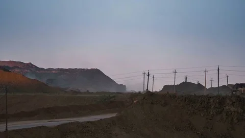 Wide shot of operating mine with dragline excavators loading ore in the Stock Footage 75458161