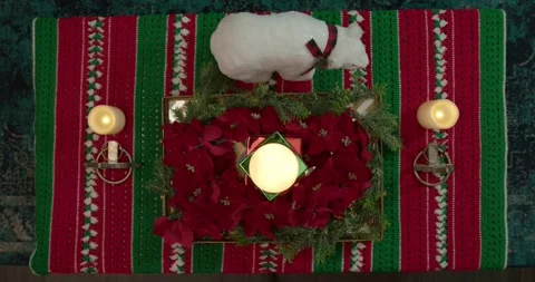 Wide Shot Overhead Right Pan of Burning Christmas Candle Stock Footage 294862463