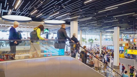 Wide shot of Passengers go down the escalators Stock-Footage 91663386