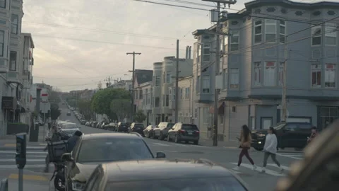 Wide shot of pastel buildings at intersection with soft light, San Francisco Stock Footage 333580617