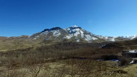 Wide Shot of a plain wintry landscape with bare leafless, stock footage. Stock Footage 304866964