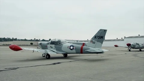 Wide Shot Plane Sitting in Runway Stock Footage 92680098