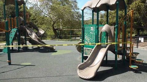 Wide shot of a playground closed down due to Coronavirus restrictions. Stock Footage 127257106