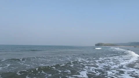 ?Wide Shot of Pristine Sand Beach and Rolling Ocean Waves in South Asia Stock Footage 329918342