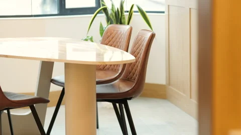 Wide shot with progressive focus on table and chairs in modern space Stock Footage 342473320