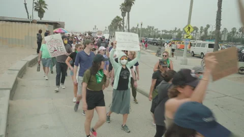 Wide Shot Of Protesters Marching For Abortion Rights Stock Footage 220362167