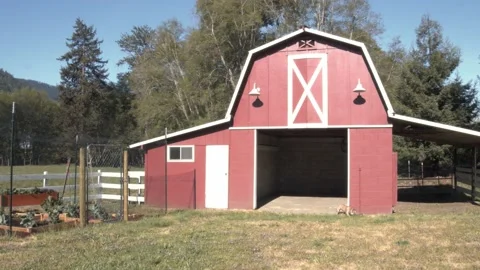 Wide Shot Of A Quaint Red Barn With French Bulldog Stock Footage 154385391