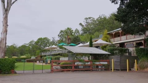 Wide shot of rear secion of an old local pub hotel in Wisemans Ferry, New South Stock Footage 332892901