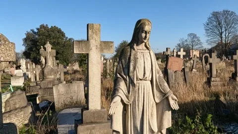 Wide Shot of Religious Statue in Front Of Old Cemetery. Stock Footage 299253128