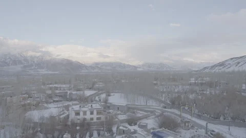 Wide Shot of Remote Building Amidst Majestic Ladakh Mountains -28th Feb 2025 Stock Footage 313376732