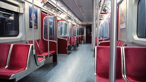 Wide shot of riding an empty subway car late at night Stock Footage 82367348