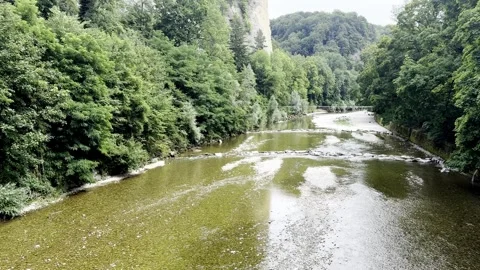 Wide Shot of a River Between Rocky Cliffs, Switzerland Stock Footage 341394764
