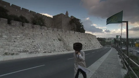 Wide shot of road outside Old City wall in Jerusalem Stock Footage 86759189