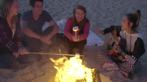 Wide shot of roasting marshmallows Stock Footage 53257411