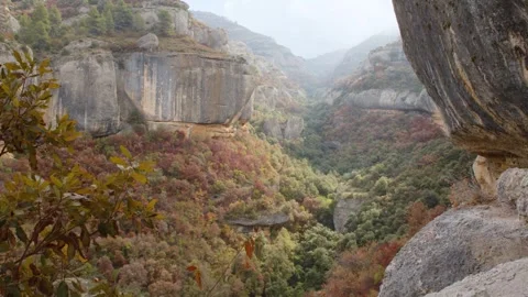 Wide shot of the rocky cliffs to climb in the valley around Margalef, Spain Stock Footage 289294956