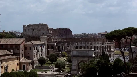 Wide shot of Roman coliseum and Arch of Titus Stock Footage 78985341