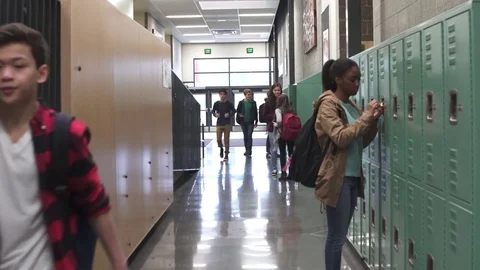 Wide shot of security person chasing young boy Video stock 73290333