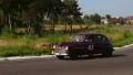 Wide shot of sluggish Ford Super Deluxe moving slowly at suburb. Landscape view HD Footage