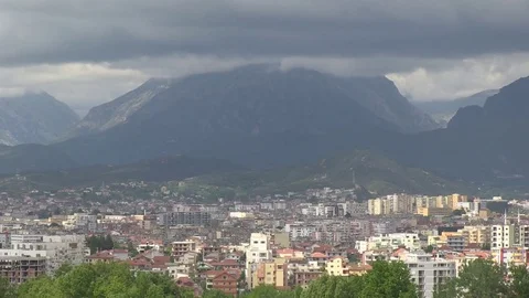 Wide shot of storm clouds rolling in above mountains outside of Tirana, Albania 스톡 동영상 75999441