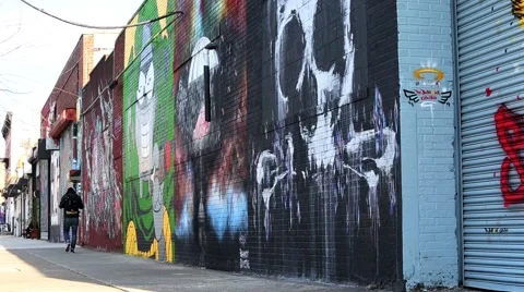 Wide shot of a street filled with graffiti street Bushwick Brooklyn New York Stock Footage