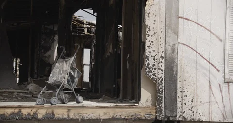 Wide Shot of Stroller Inside Burnt Out Home - Pan Left Stock Footage 89942258