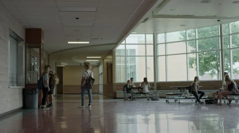 Wide shot of students hanging out in school lobby / Mapleton, Utah, United Stock Footage 68218161