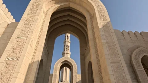 Wide shot of Sultan Qaboos Mosque entrance with smooth camera movement in Oman Stock Footage 339890098
