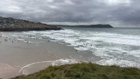 Wide shot of surfers in a bay Stock Footage 239658191