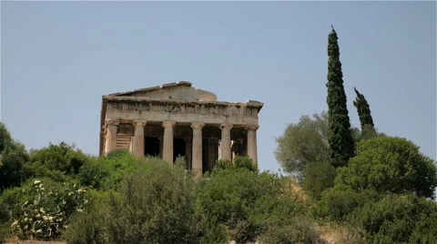A wide shot of the Temple of Hephaestus in Ancient Agora of Athens, Greece Stock Footage 64409624