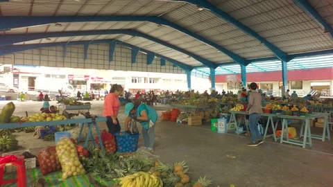 Wide Shot Of Tourist Browsing At Local Market Stock Footage