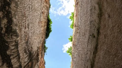 Wide shot of towering white rock walls and blue sky on Bali island Video stock 339946130